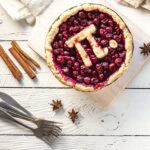 celebrating pi day with a cherry pie and the greek symbol for pi