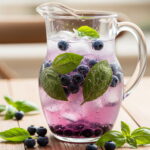 pitcher of blueberry basil spritzer recipe